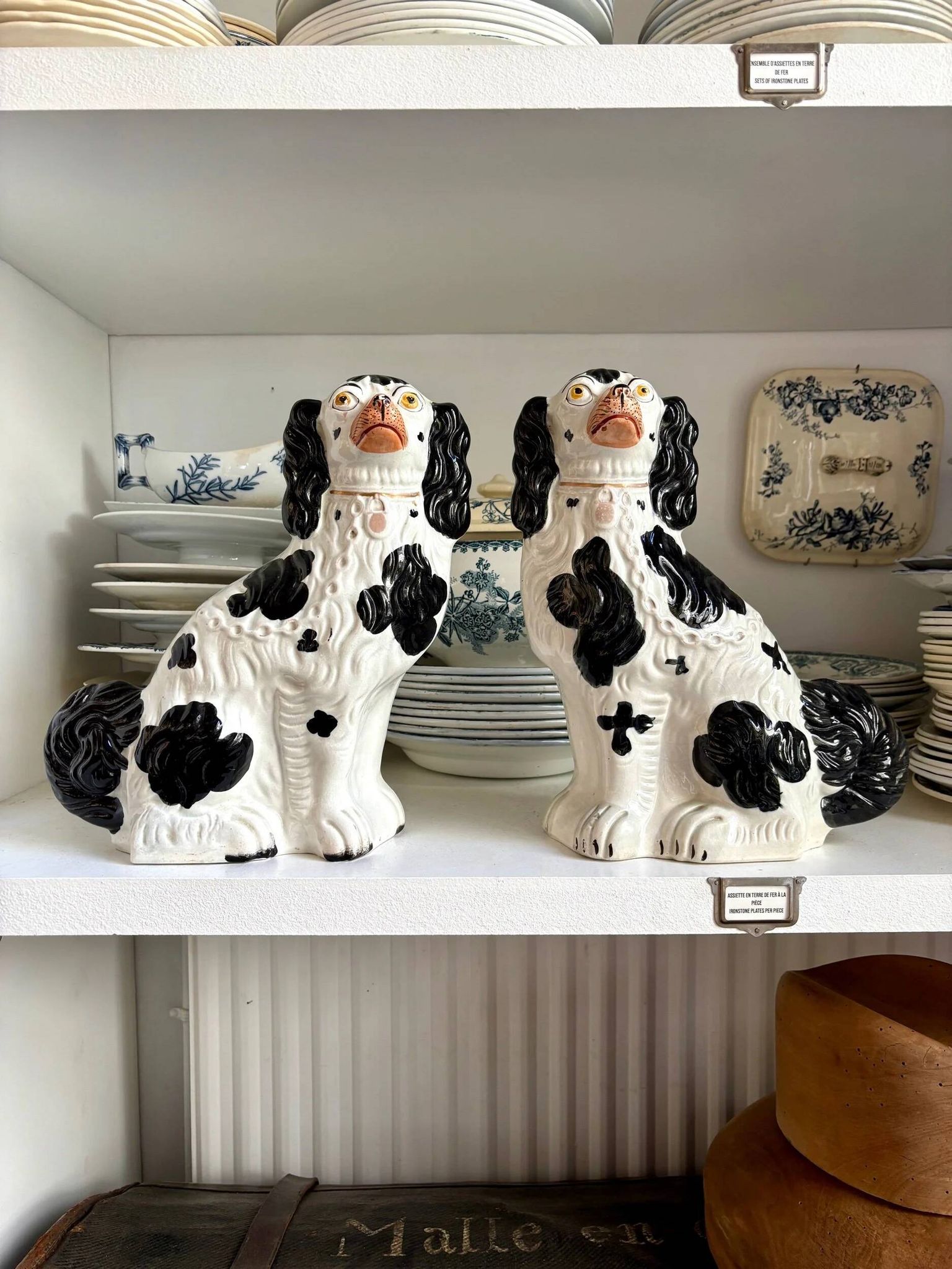 Pair of black Cavalier King Charles dogs in Staffordshire pottery, 19th century.