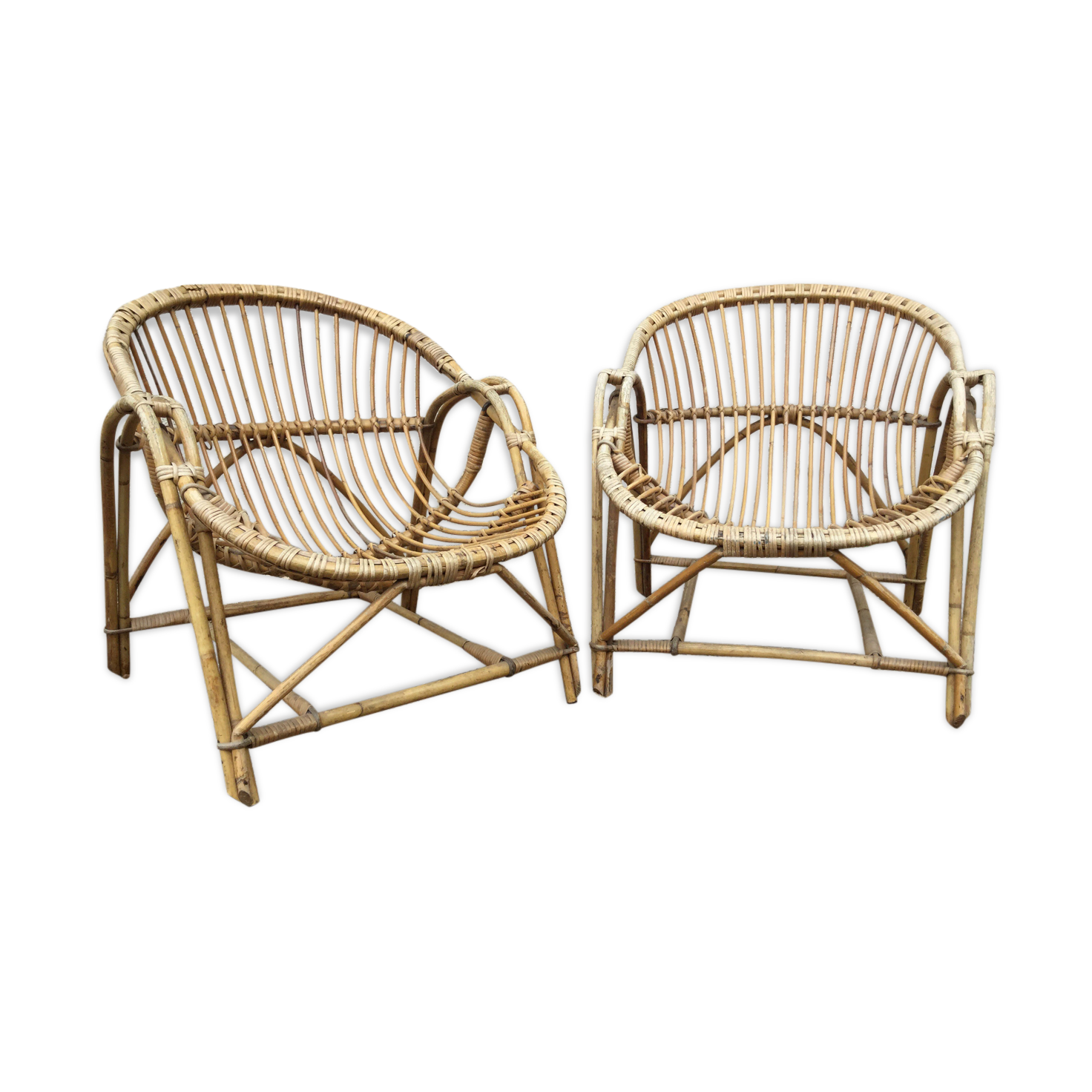 A pair of rattan armchairs
