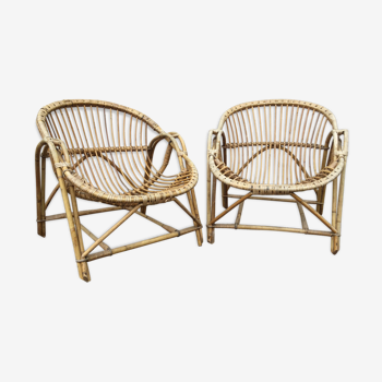 A pair of rattan armchairs