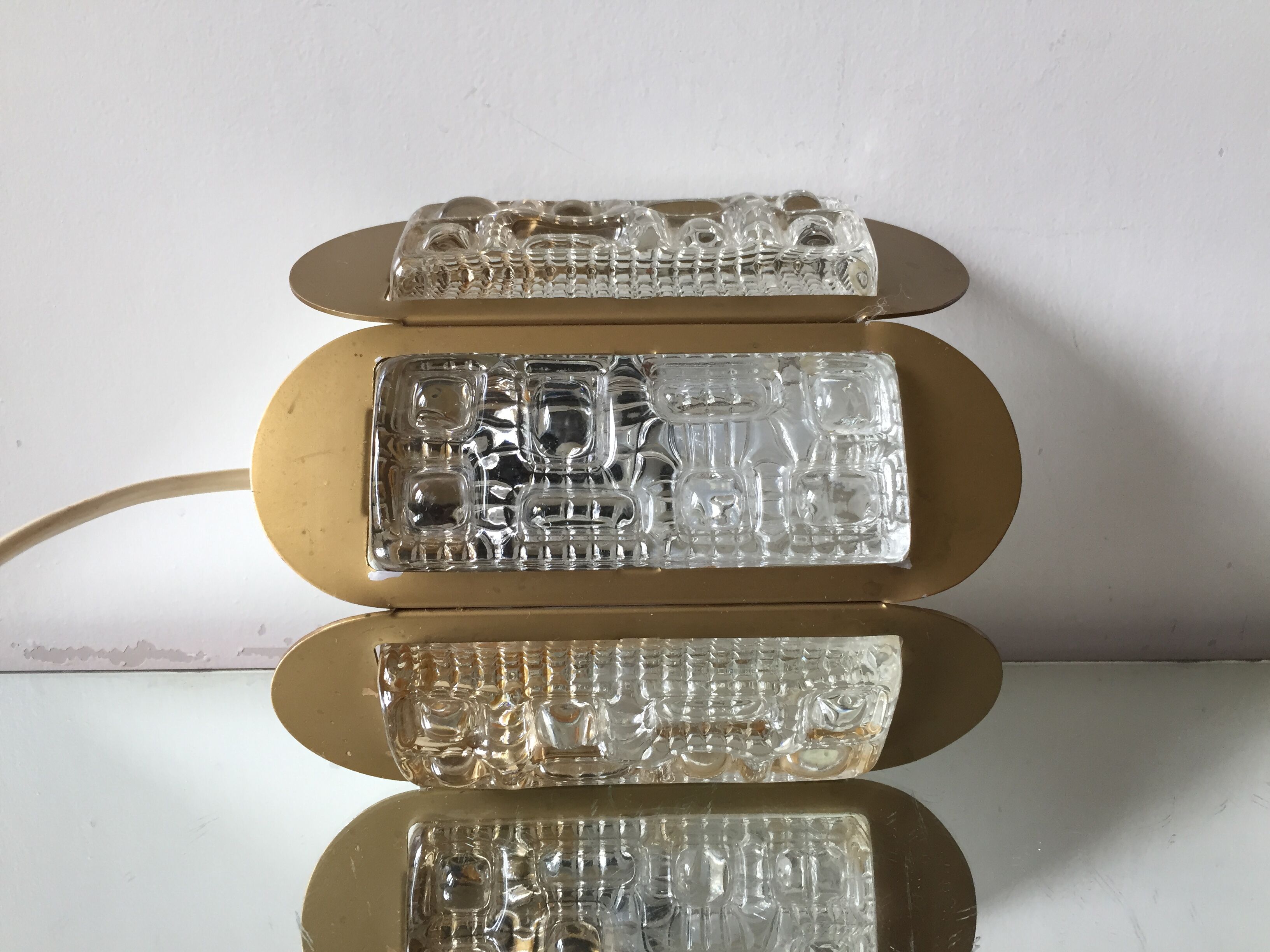 Scandinavian midcentury wall light in crystal and mat gold colored metal