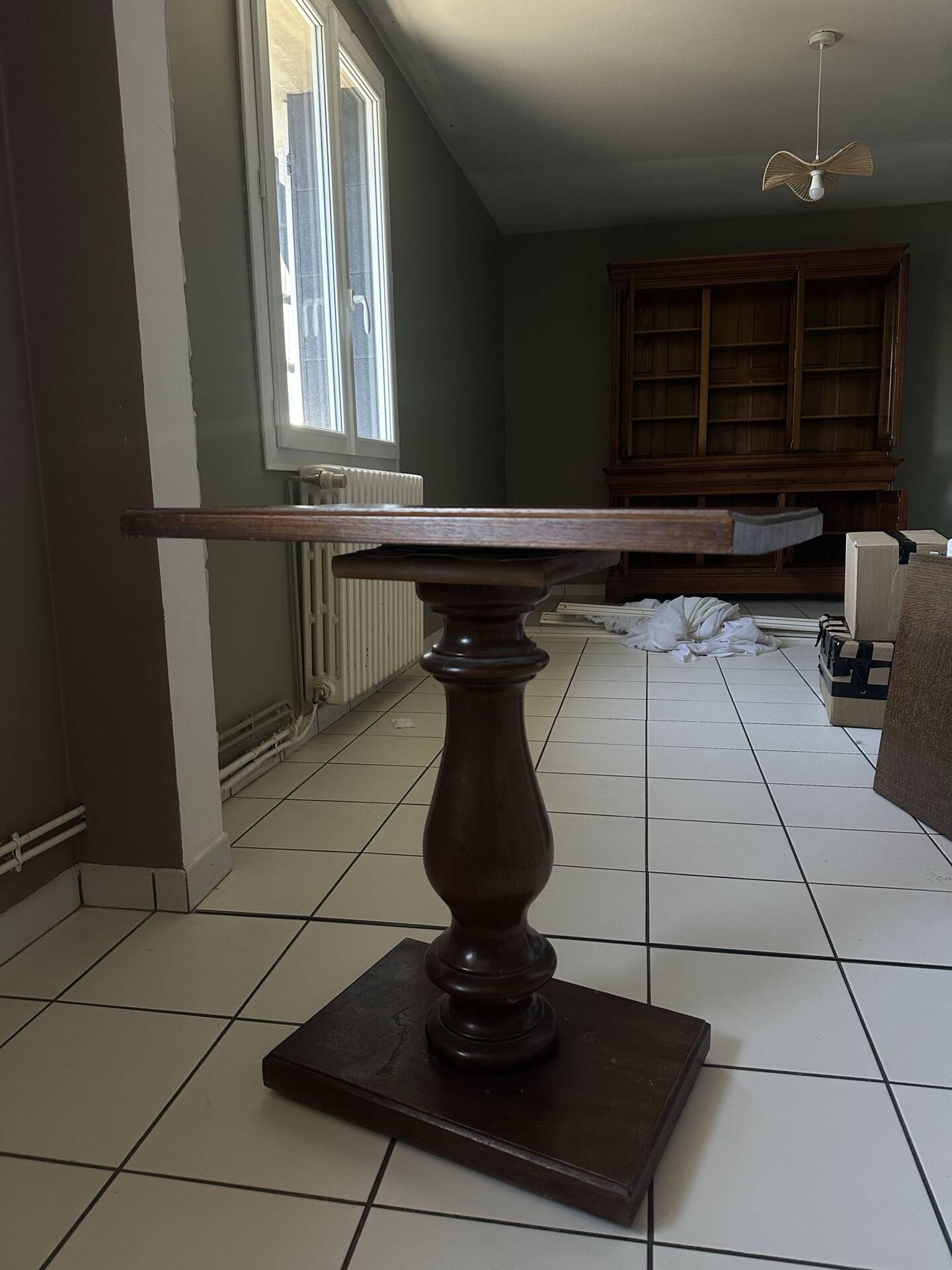 Small wooden bistro table with a turned central leg.