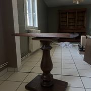 Small wooden bistro table with a turned central leg.