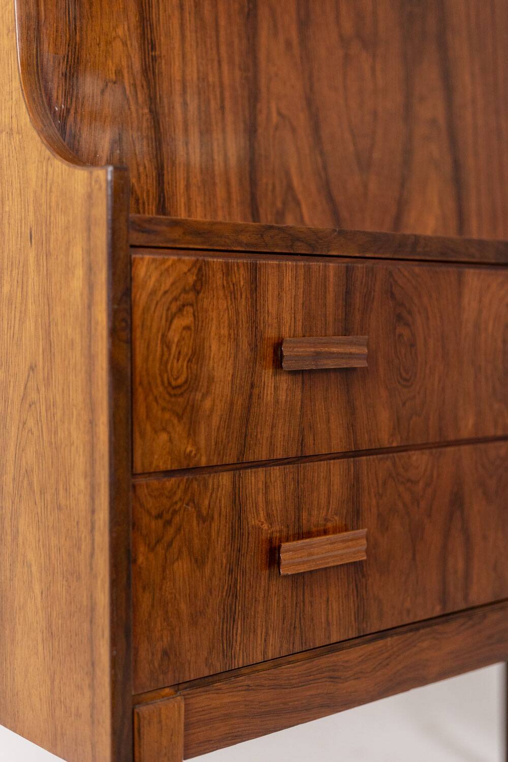 Rosewood chest of drawers with 2 drawers, forming a secretary. 1970s.