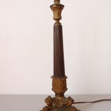 Empire period torch candle holder in bronze tripod base with lion's claws