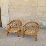 Two large rattan armchairs