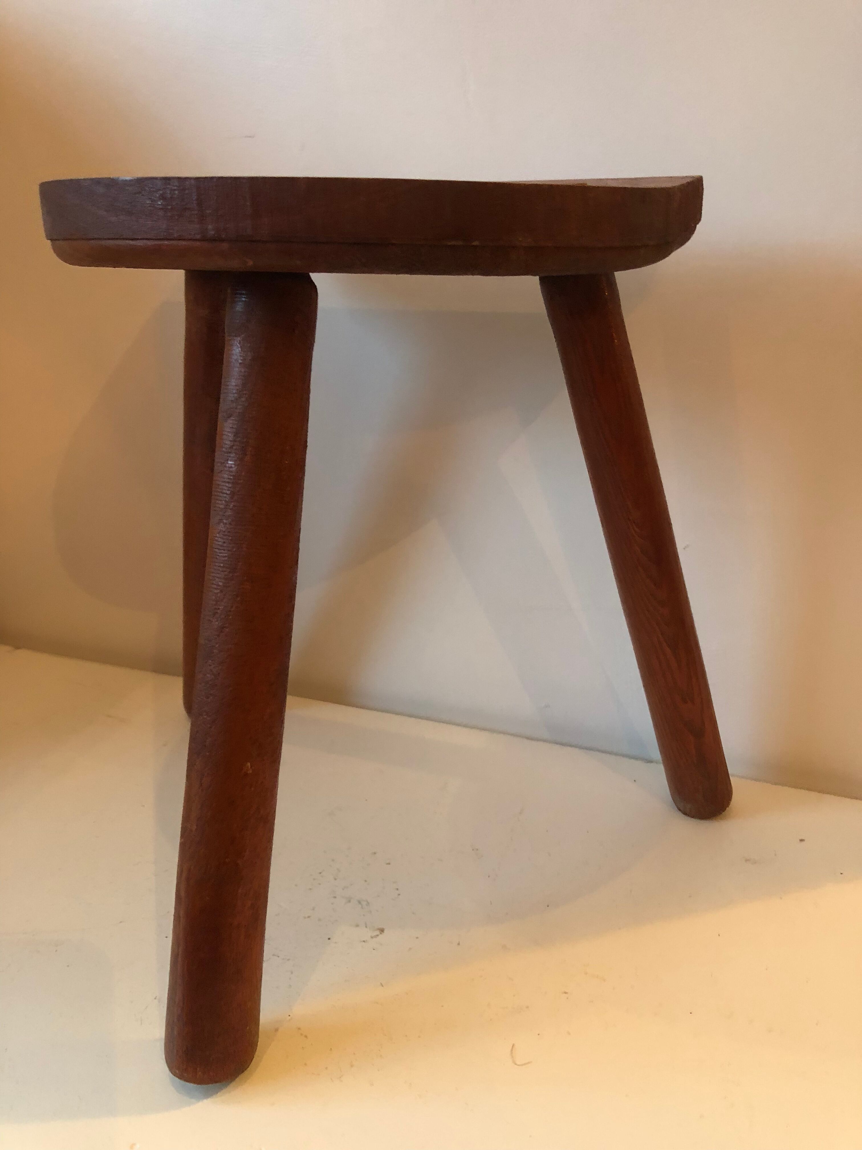 Old wooden tripod stool