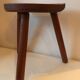 Old wooden tripod stool
