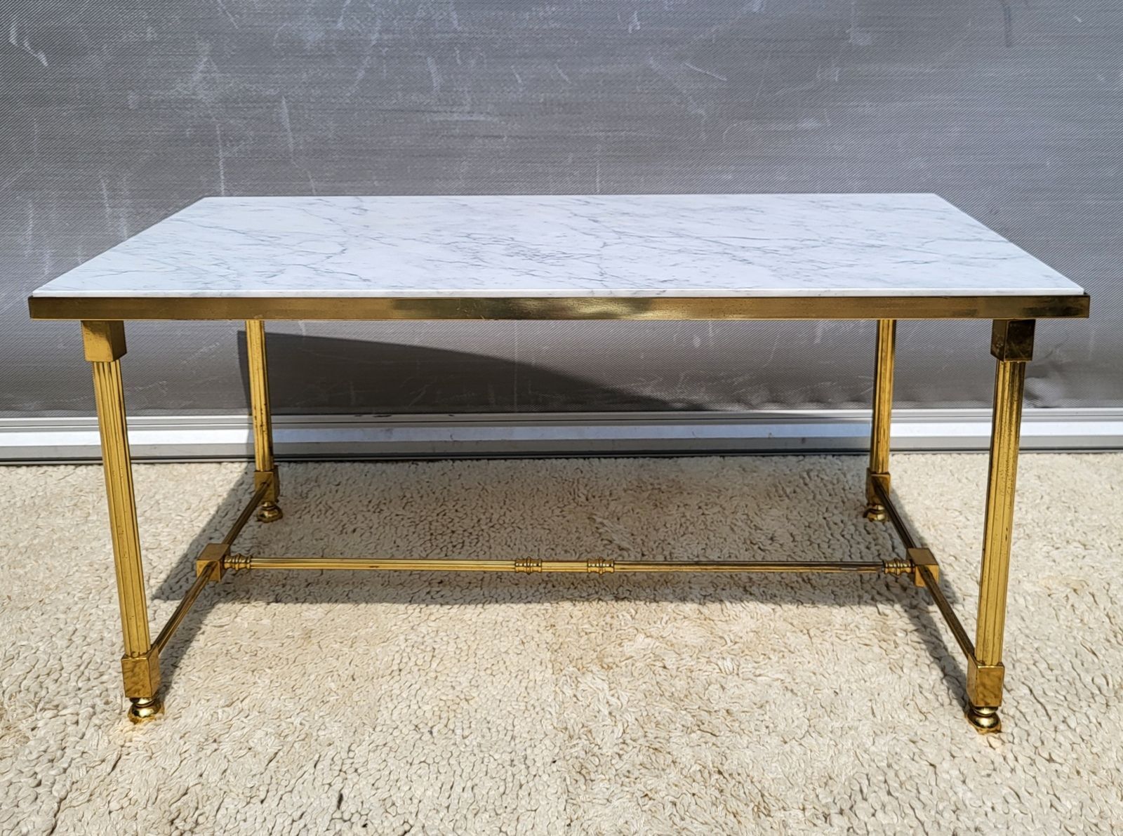 Hollywood Regency style coffee table • marble and brass