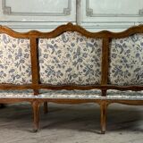 Louis XV bench in carved wood with oak patina, 18th century