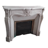 Louis XV style fireplace in veined white Carrara marble and XI ceramics.