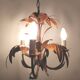 Golden metal chandelier palm leaves