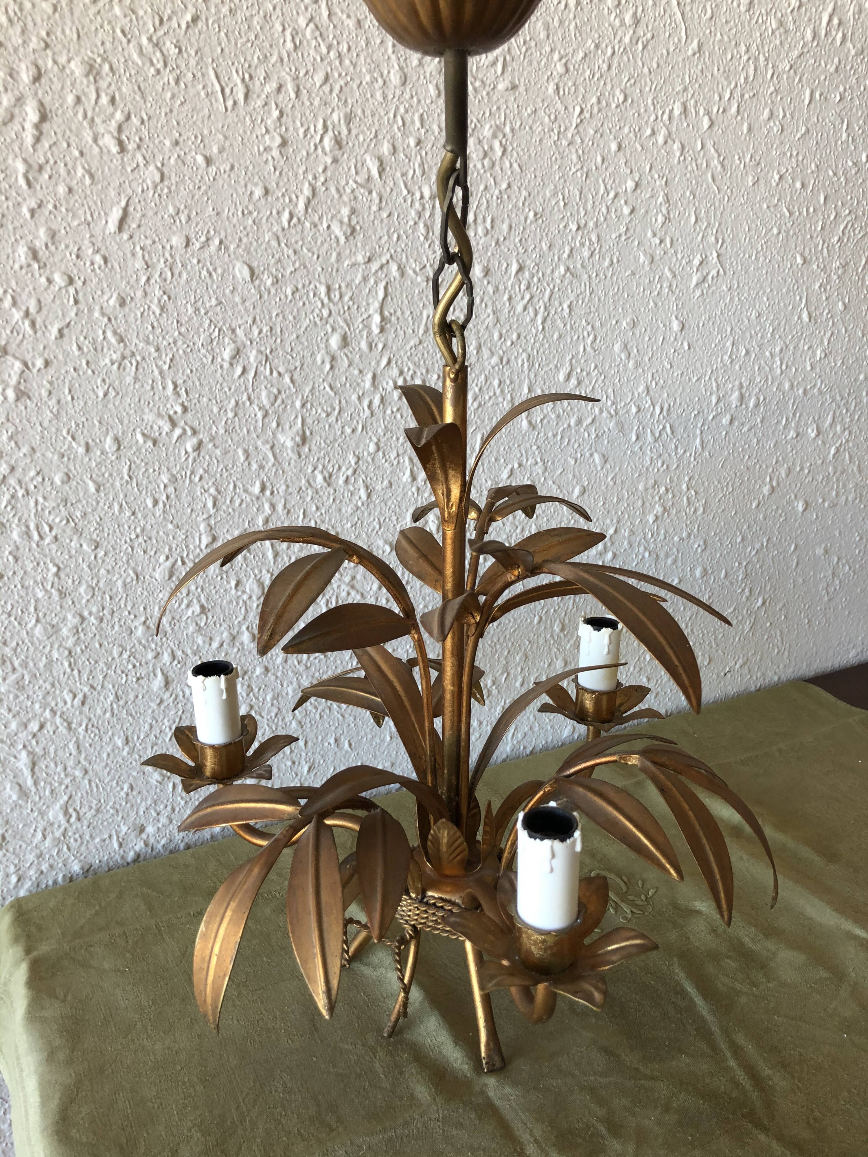 Golden vintage chandelier with leaf decoration