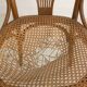 Chaise bistrot avec accoudoirs en bois cintré et assise en cannage