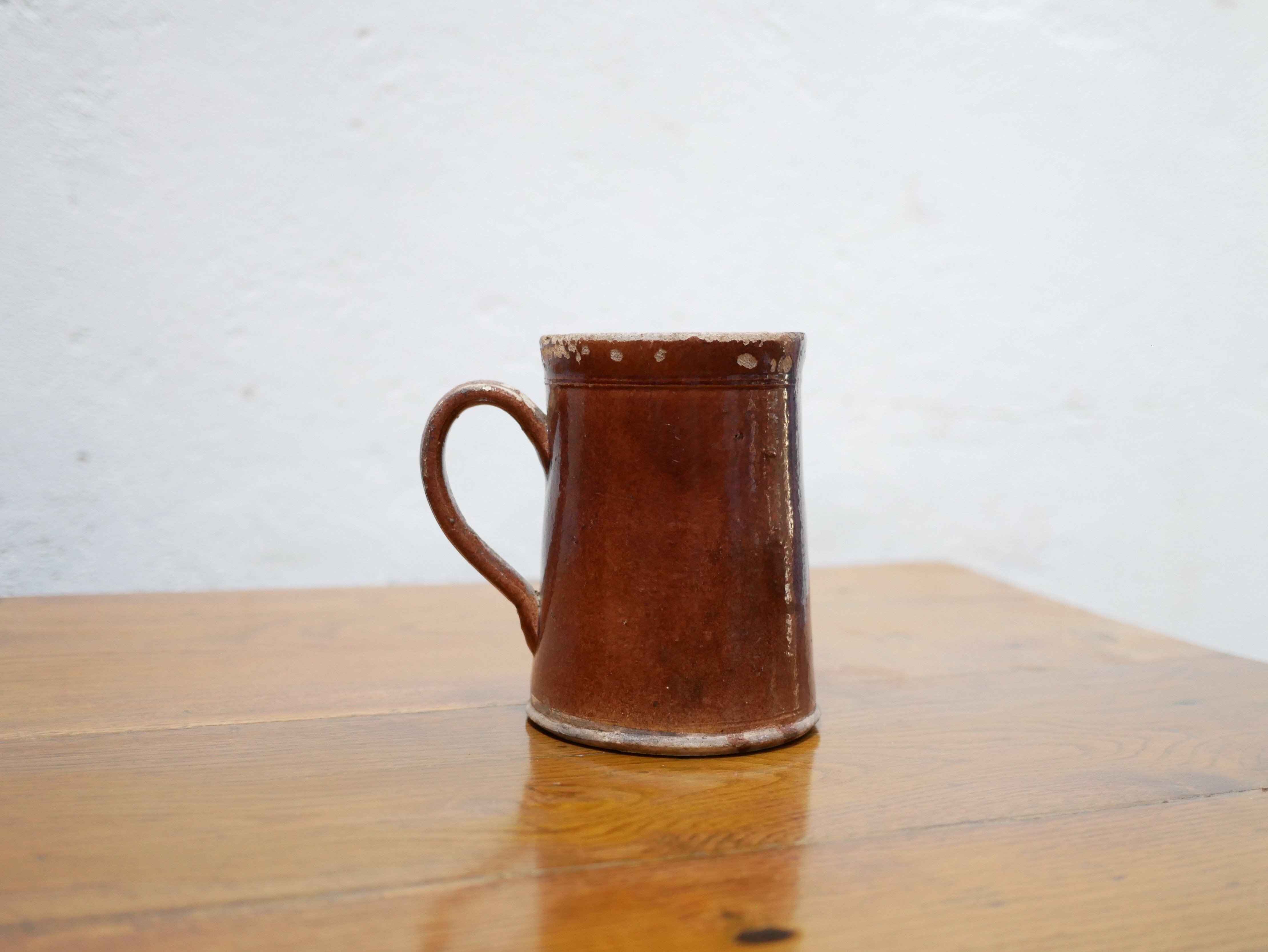 Vintage pitcher in glazed terracotta