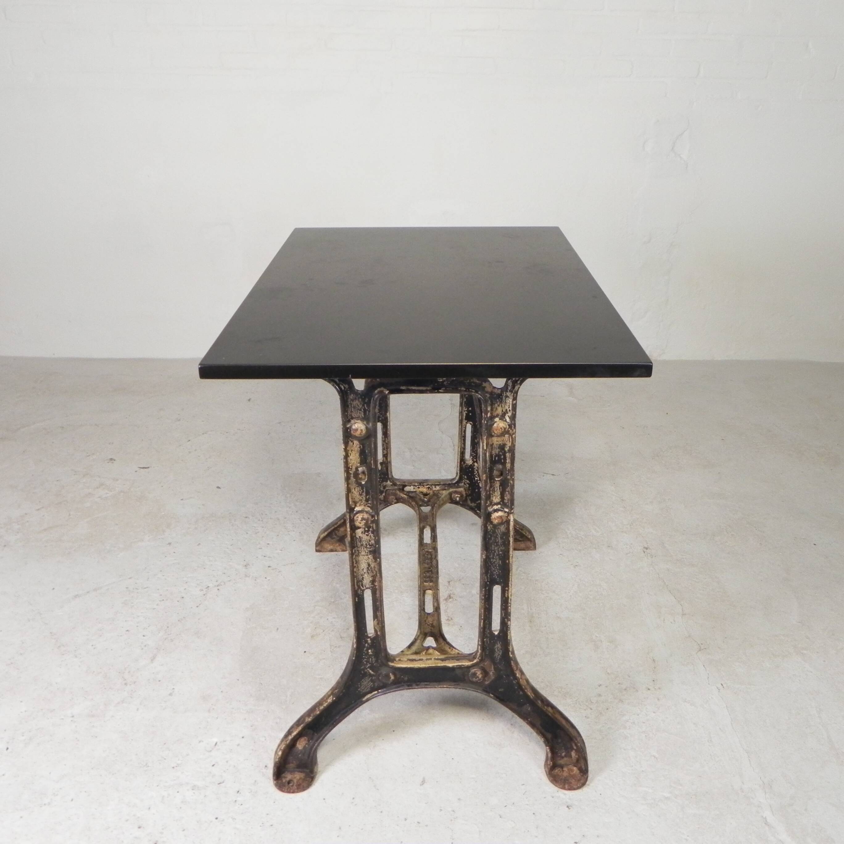 Industrial table, garden table with hard stone slab on cast iron frame, 1930s