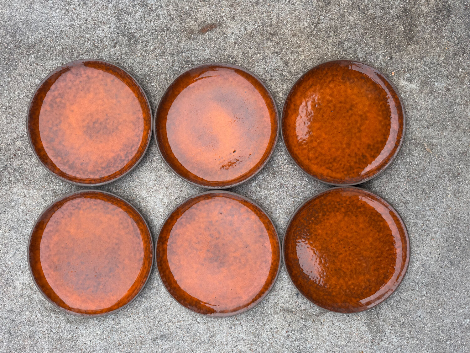 Orange glazed ceramic plates from the 1970s