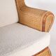 Large wicker armchair and its ottoman