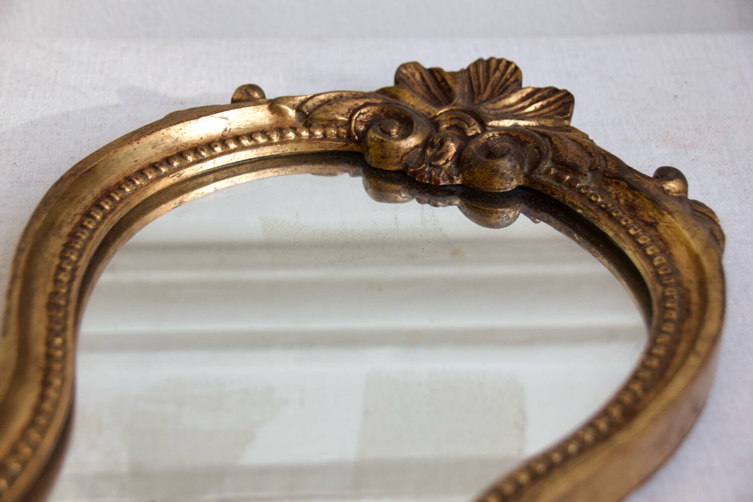 Small golden mirror in baroque style