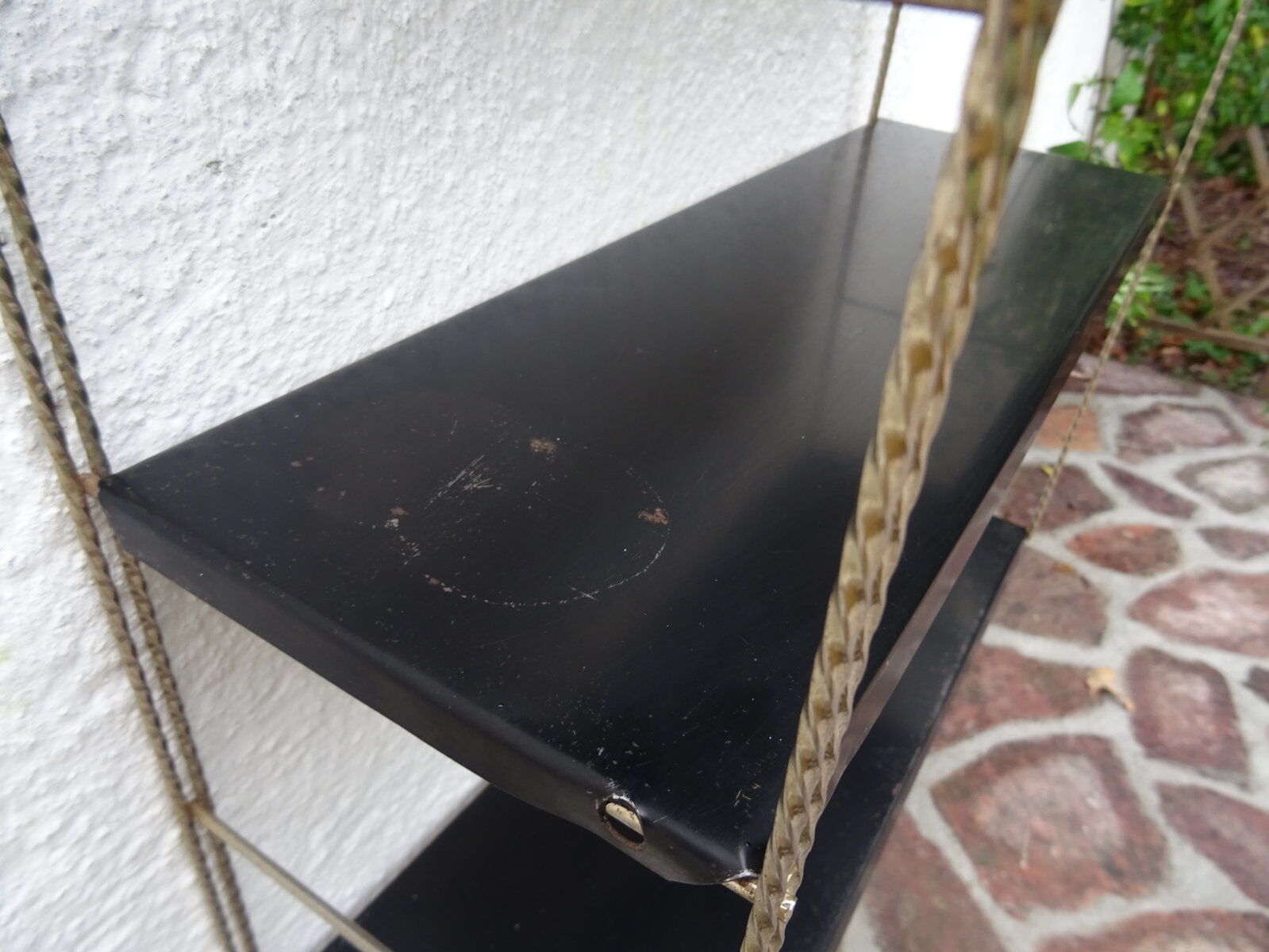 Metal thong wall shelf