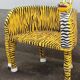 Wooden armchair with a "tiger" appearance.