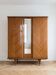 Retro wooden veneer wardrobe: 3 doors with mirror and tapered legs.