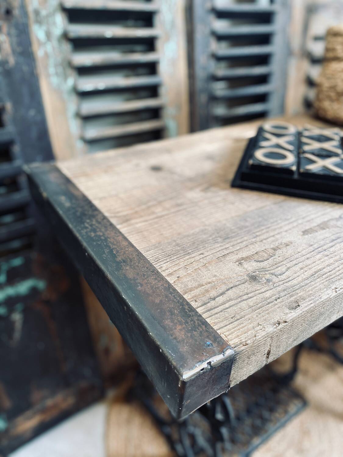 Vintage wooden table with a cast iron base.