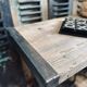 Vintage wooden table with a cast iron base.