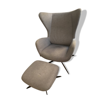 Armchair with pouf