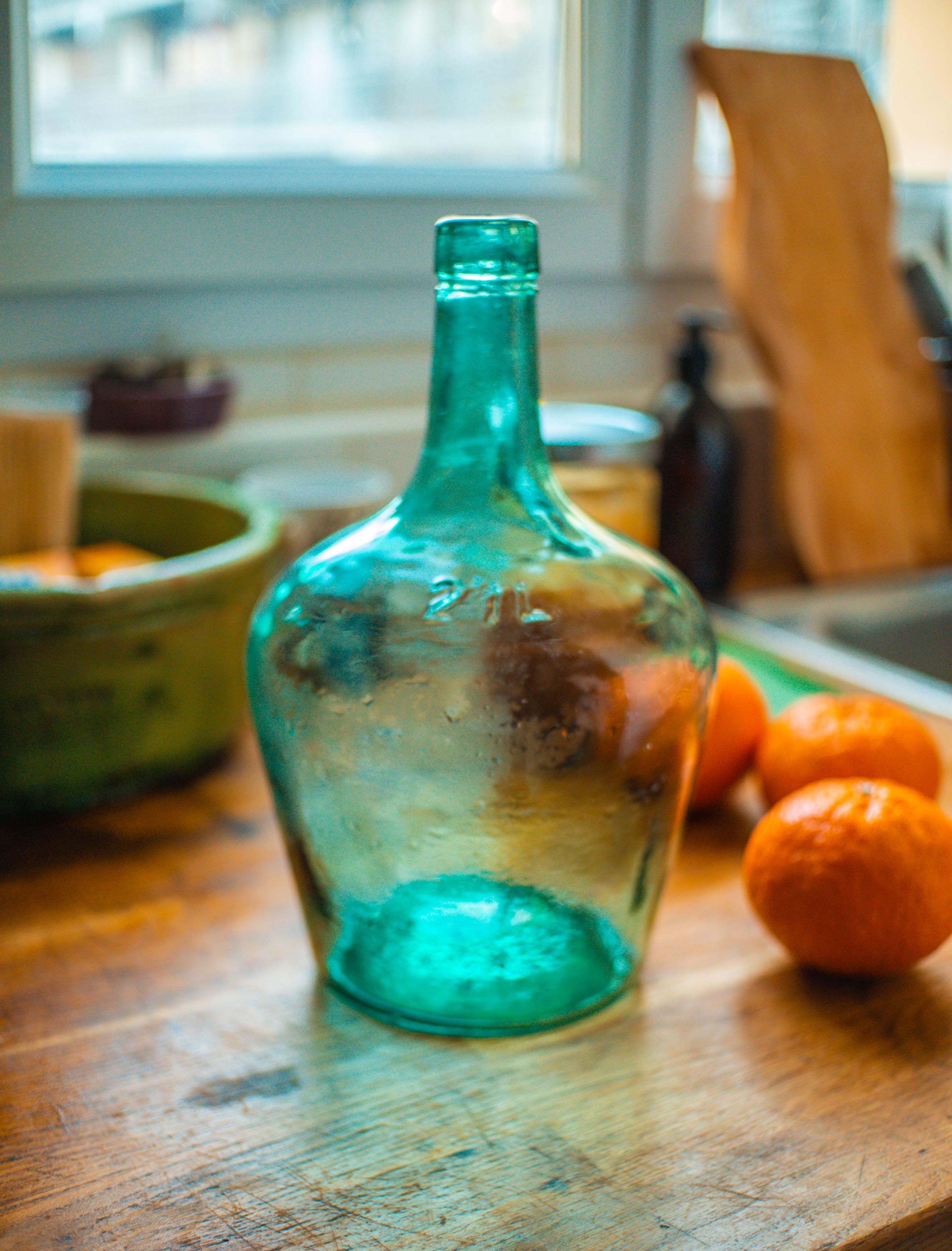 Dame Jeanne with her wicker case