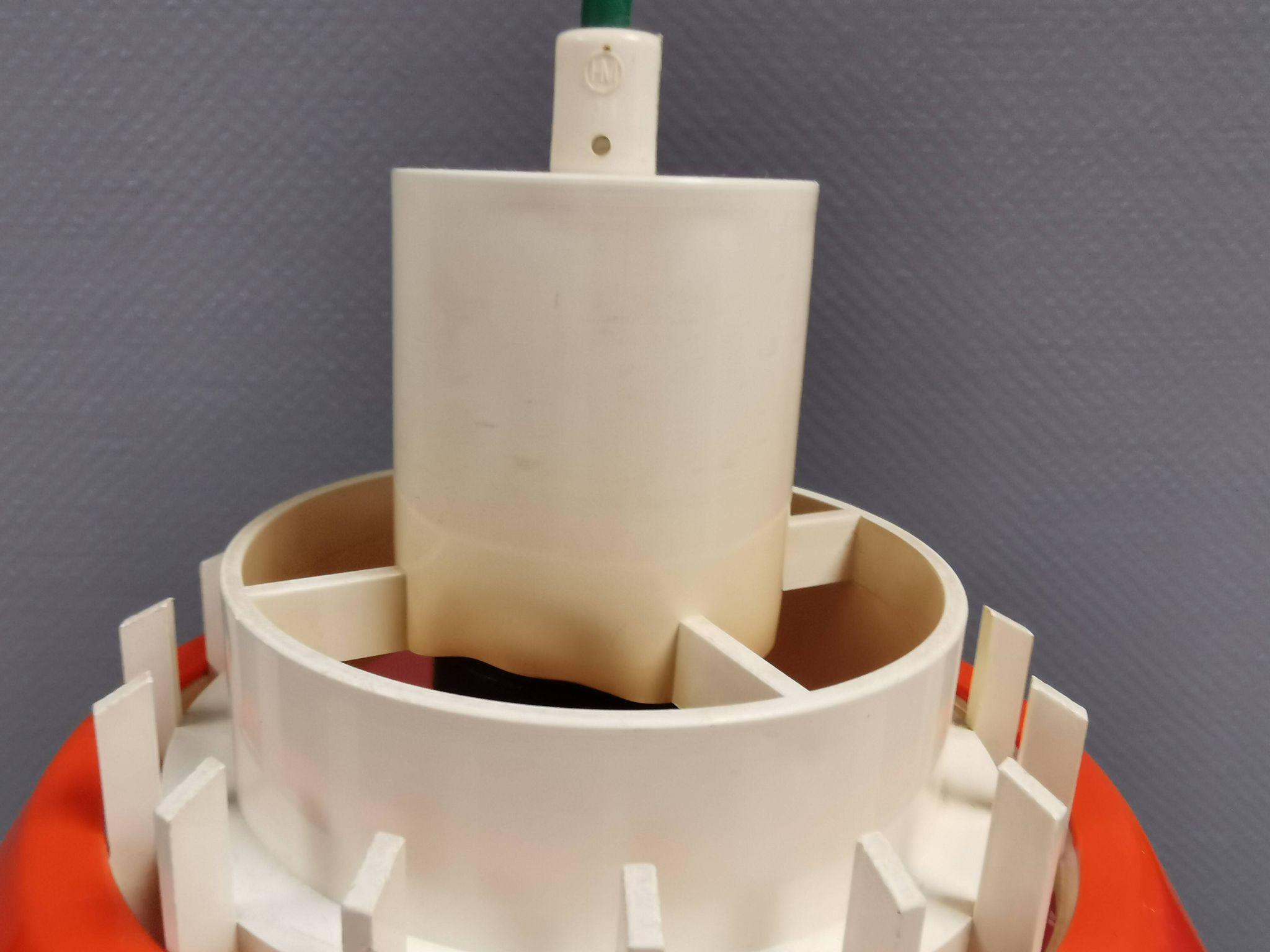 An orange pendant lamp made from hard-pressed ABS plastic. Denmark 1970s