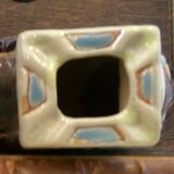 Small brown ceramic elephant vase