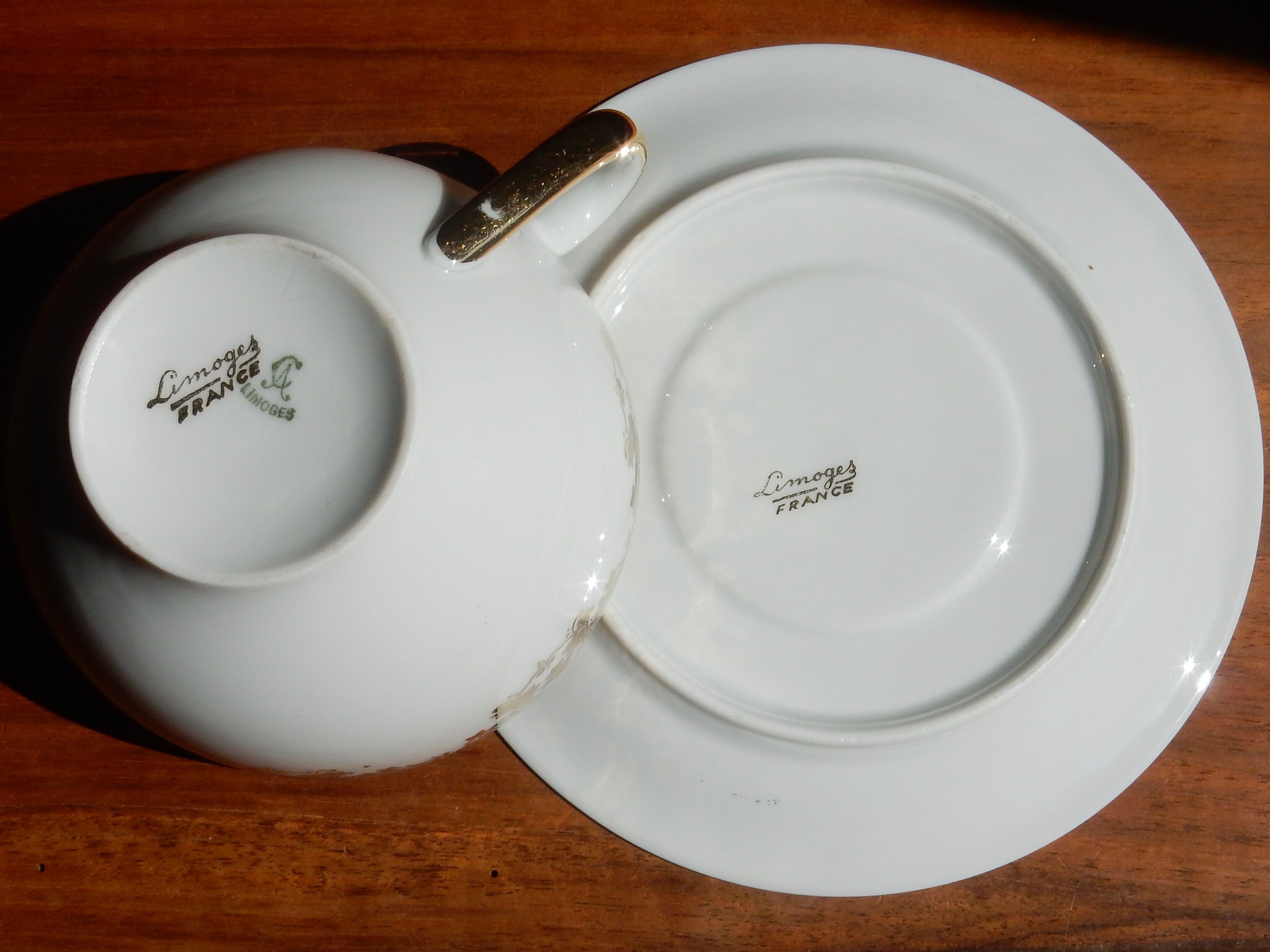 Charles Ahrenfeldt's teacup and subcup limoges