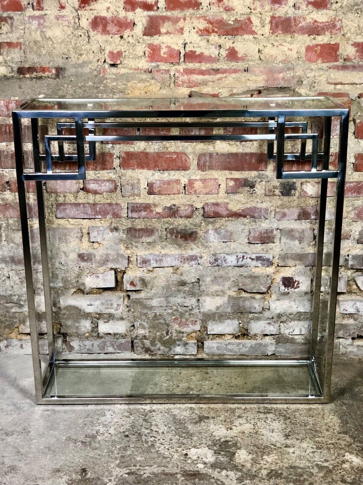 Art Deco style console in chromed metal with glass top