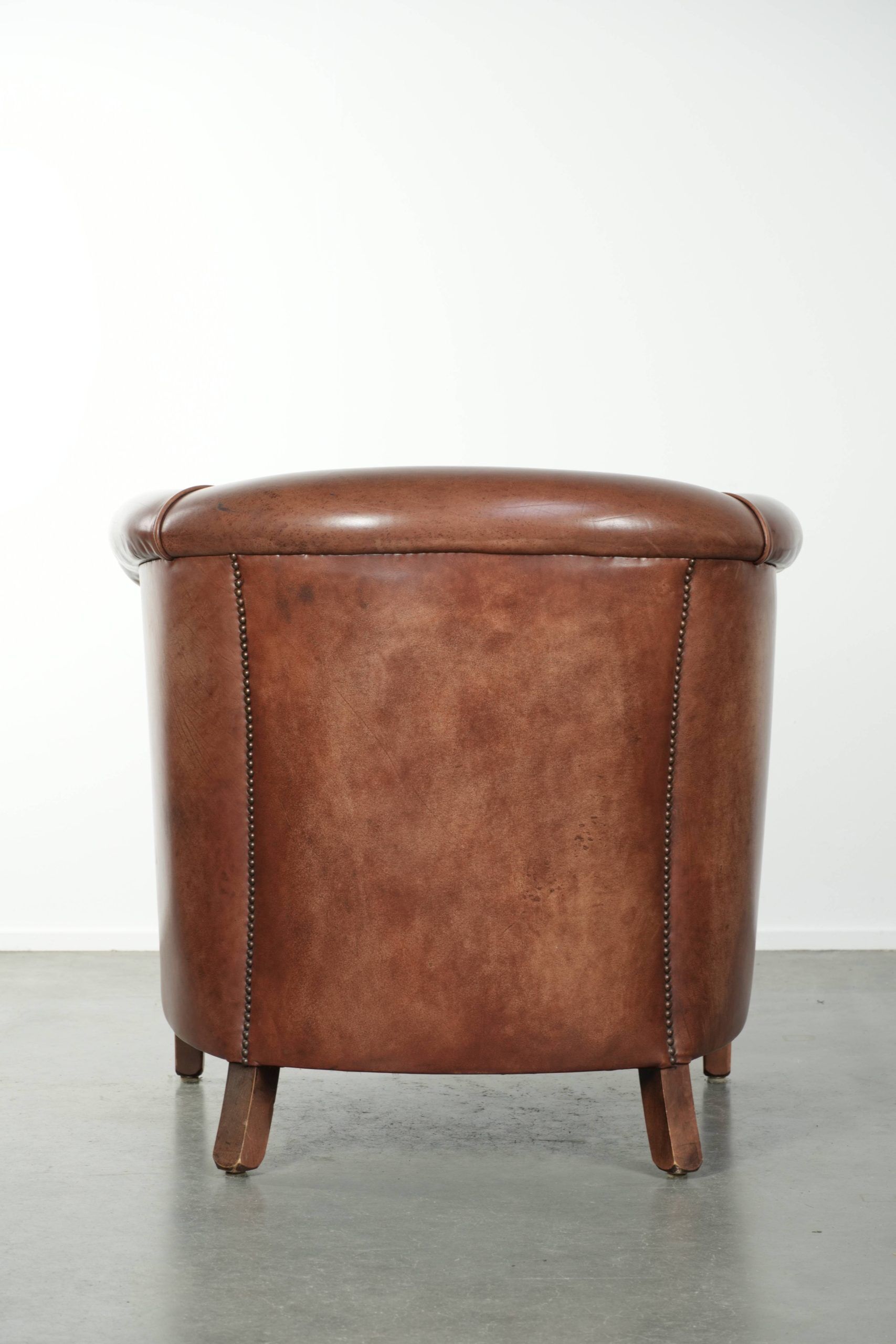 Cow leather club armchair in beautiful dark cognac colour in English style