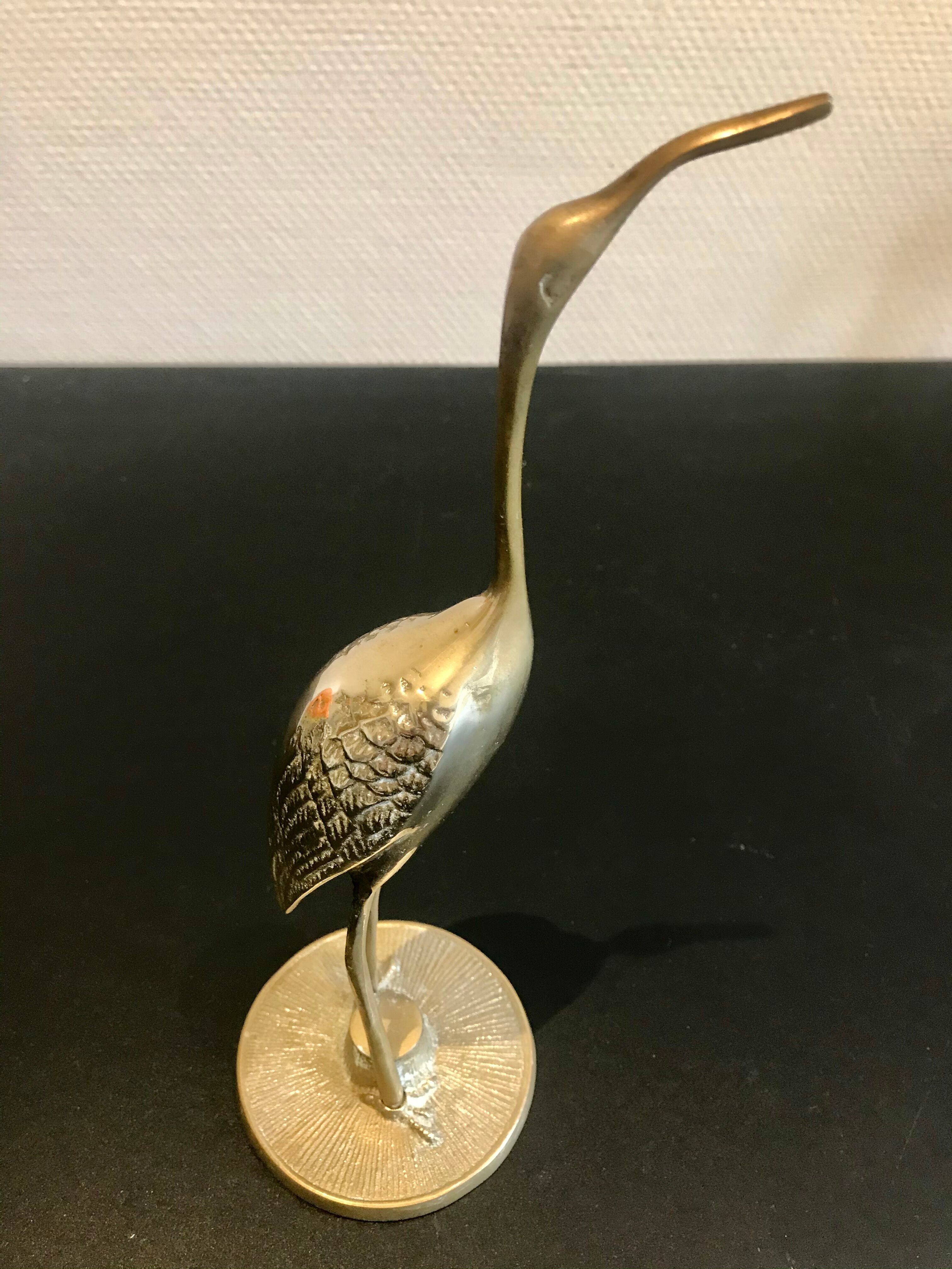 Couple of brass birds