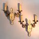 Pair of gilded bronze and green lacquer wall sconces by Maison Lucien Gau, Paris.