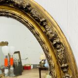 Large golden oval mirror