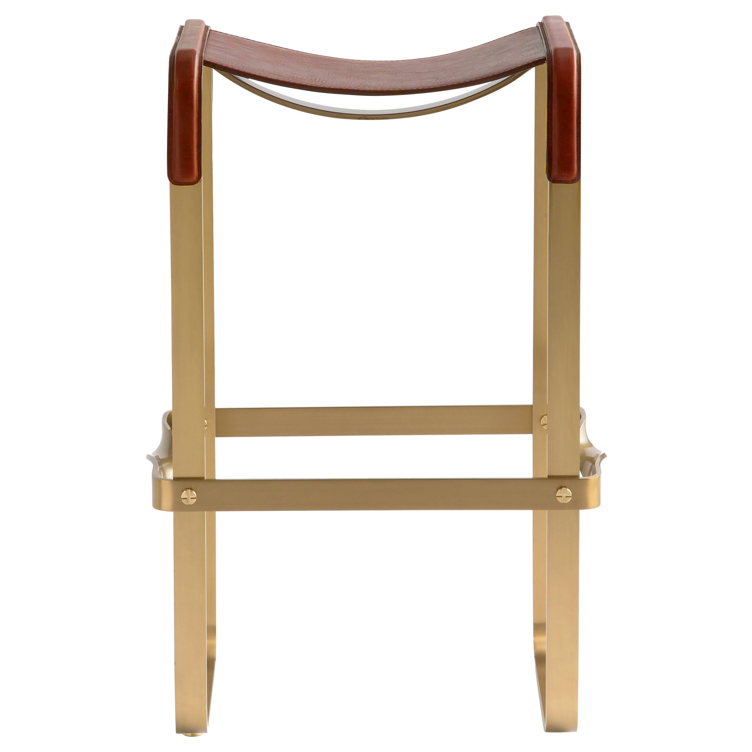 Contemporary kitchen stool, aged brass metal and cognac leather.