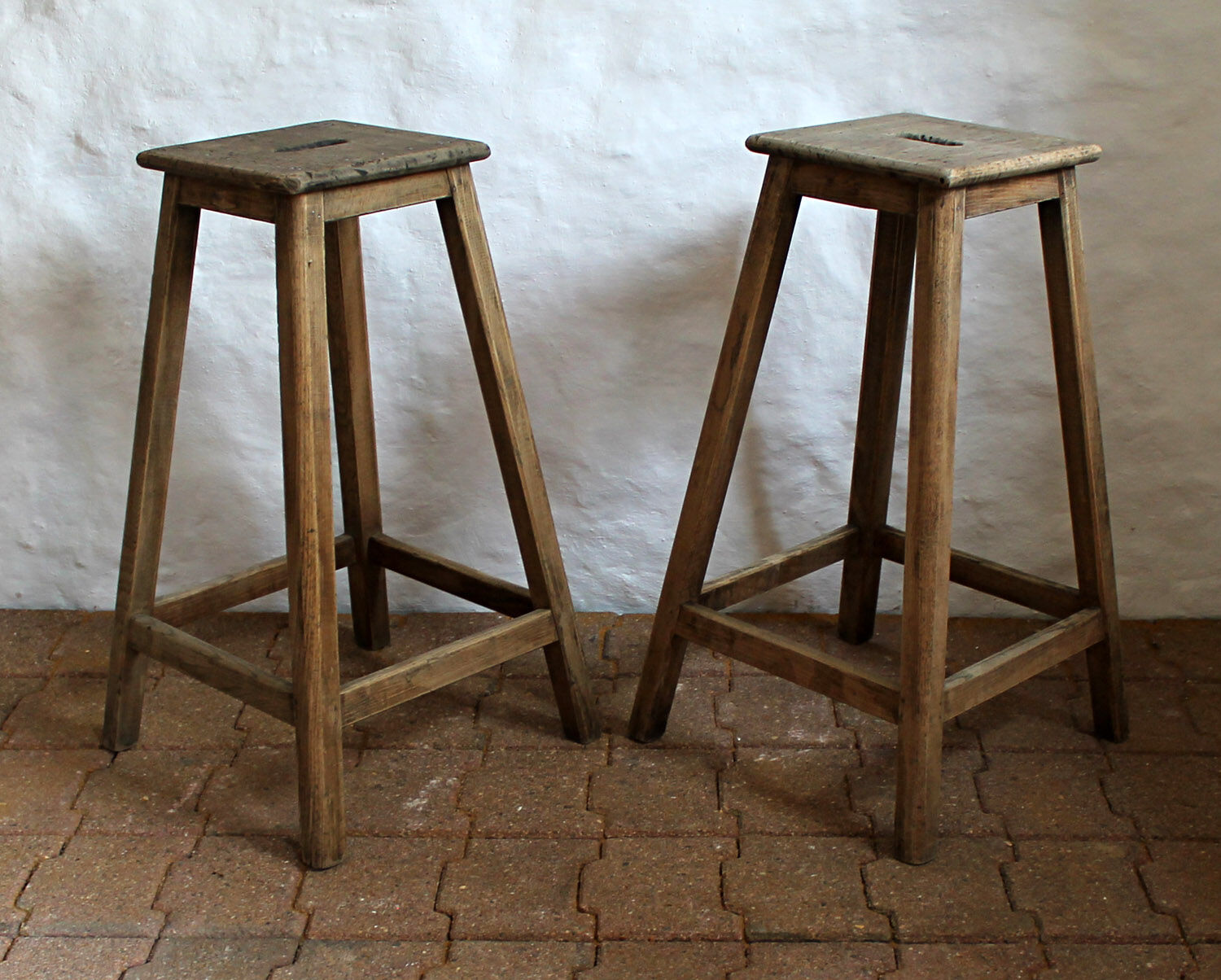 Pair of high workshop stools in raw wood