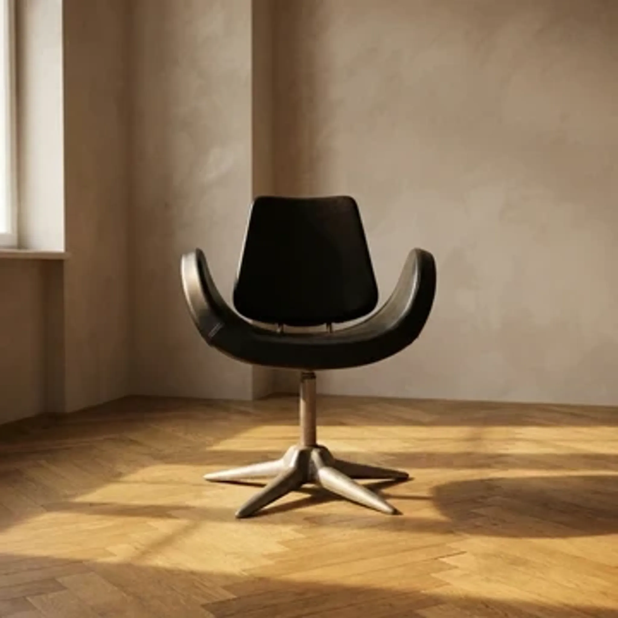 Alipes black swivel salon chair with chrome star base by Giorgetto Giugiaro for Gamma & Bross, Italy, contemporary, 85 × 70 × 60 cm