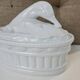 White porcelain terrine with white goose