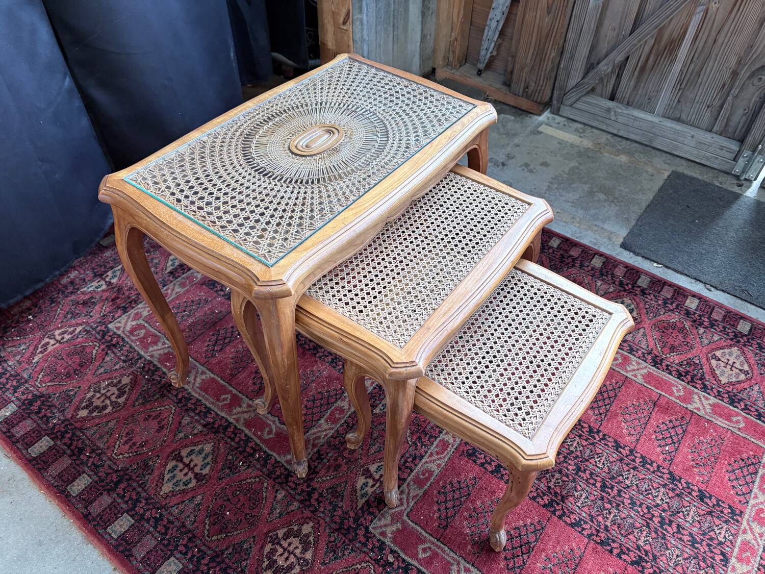 Vintage nesting tables in wood and cane – perfect condition.
