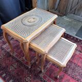 Vintage nesting tables in wood and cane – perfect condition.