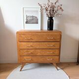 Vintage chest of drawers with checkerboard and compass feet