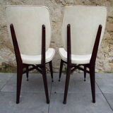 2 skai and wooden chairs