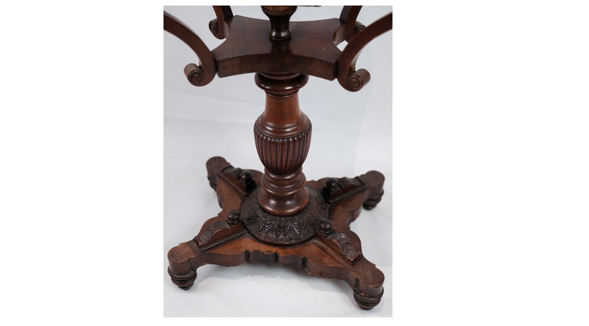 Antique mahogany sewing table on a pillar from around the year 1840s