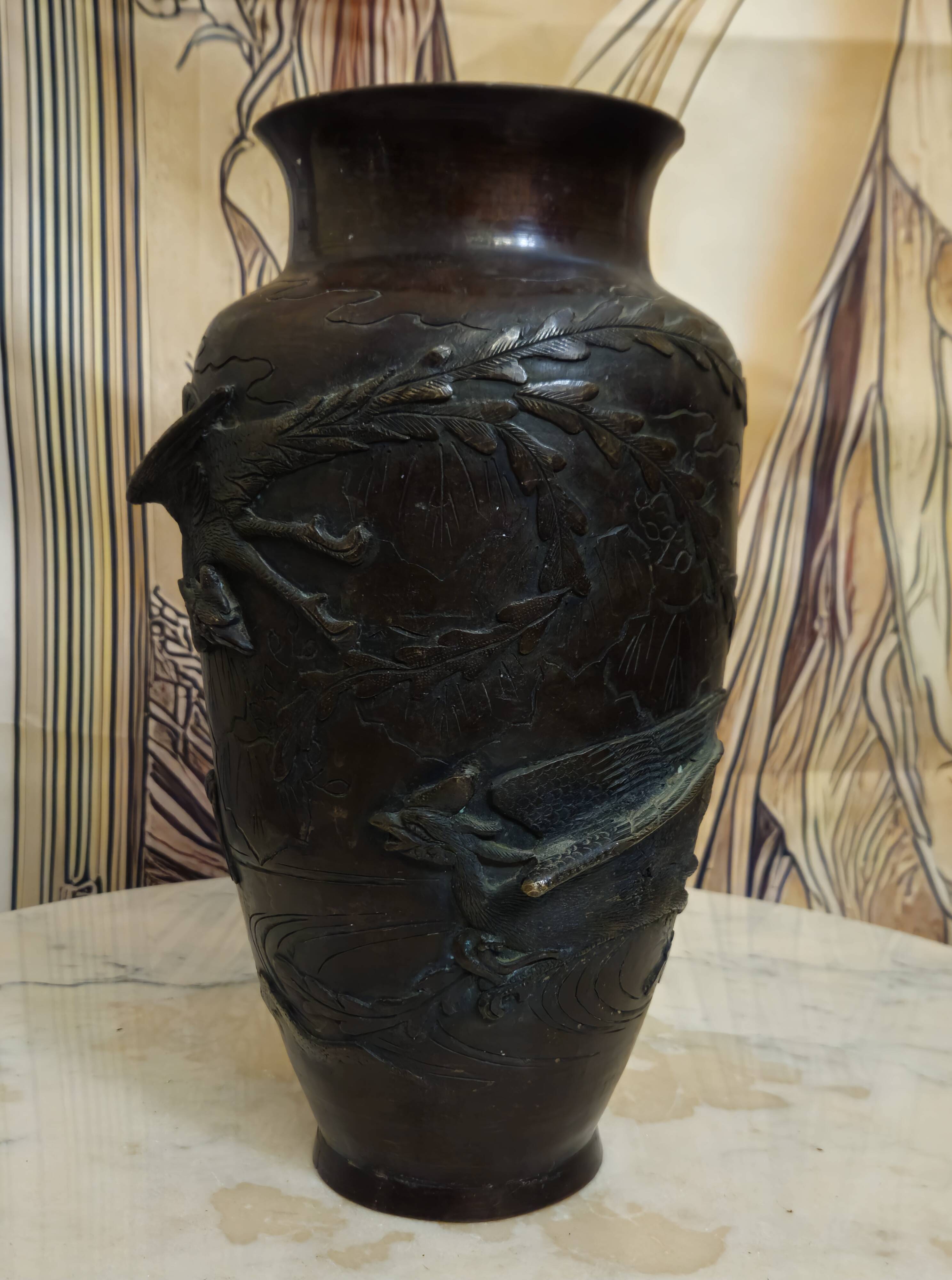 Patinated bronze vase with relief decoration