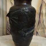 Patinated bronze vase with relief decoration