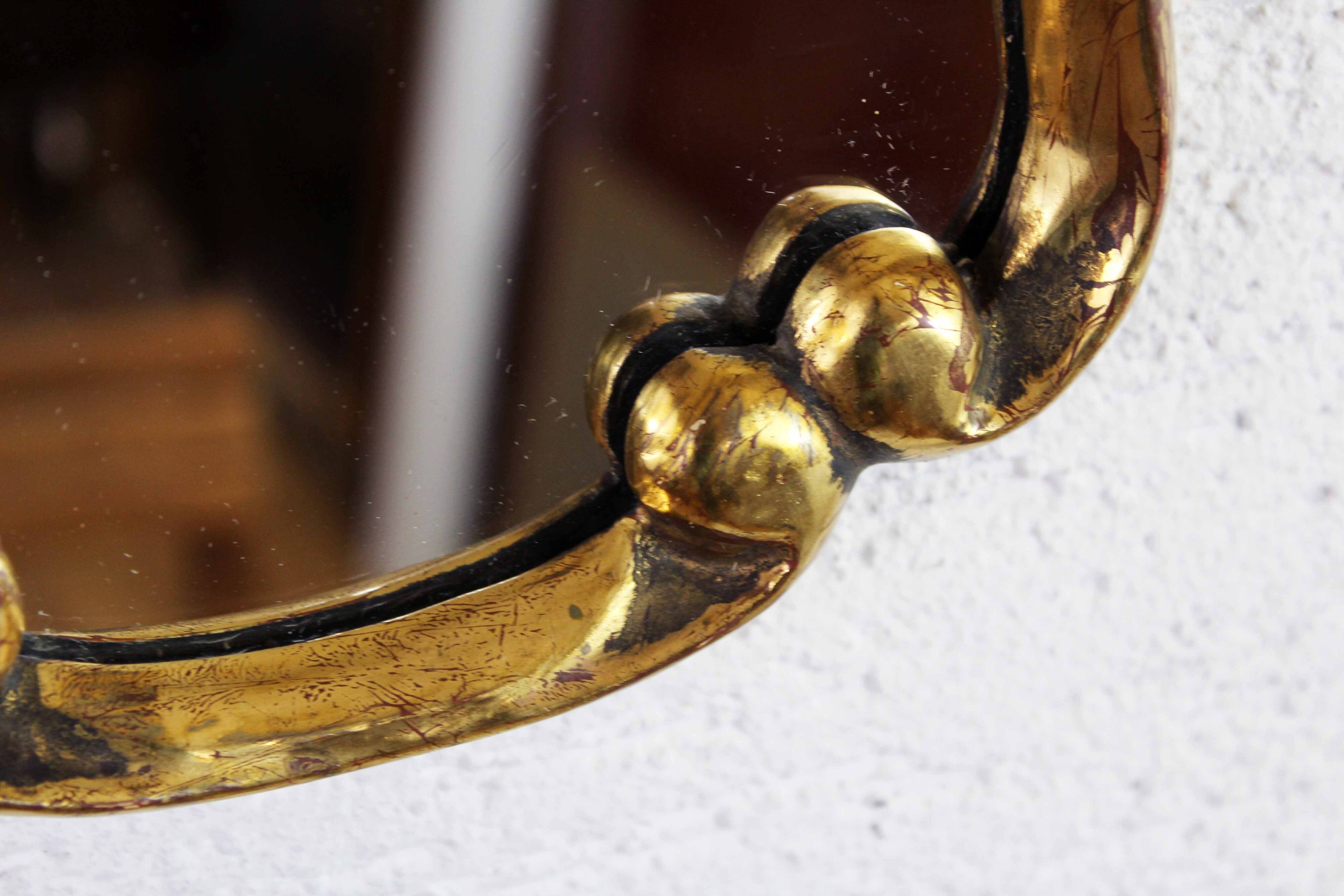 Mirror in gilded wood with leaf