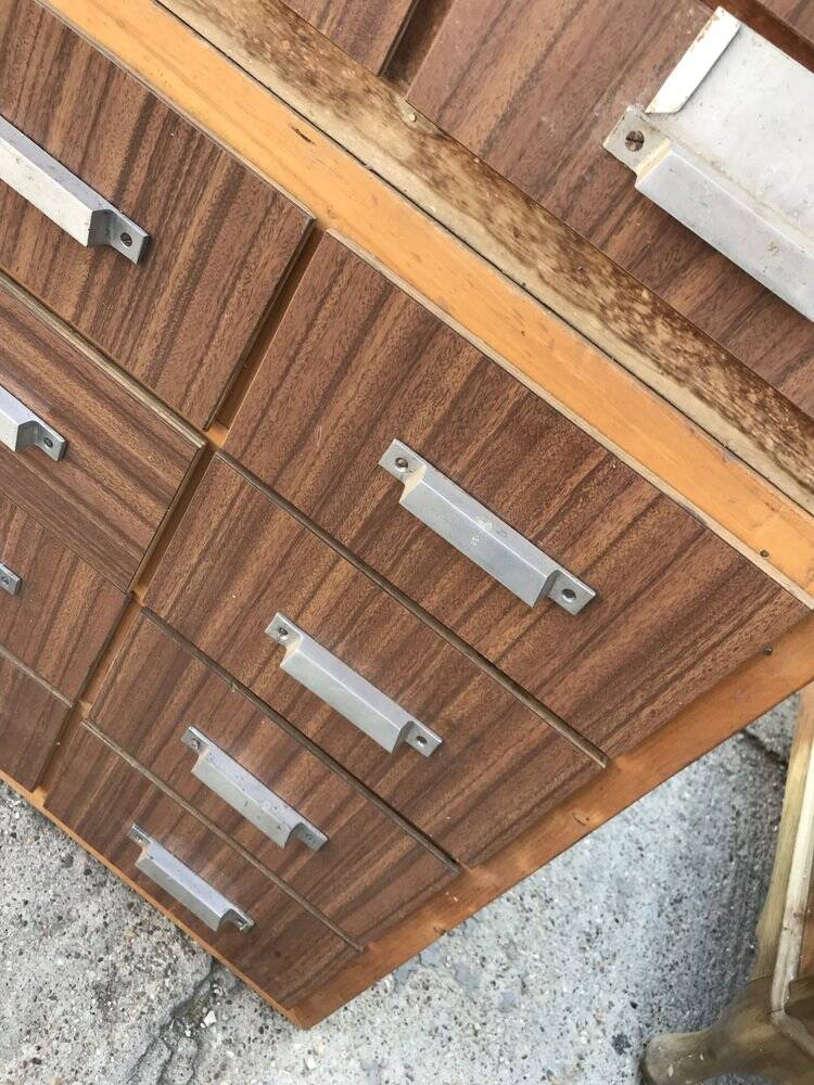 Brown wooden industrial wardrobe, multiple drawers, 1950s, workshop storage, Czech Republic.